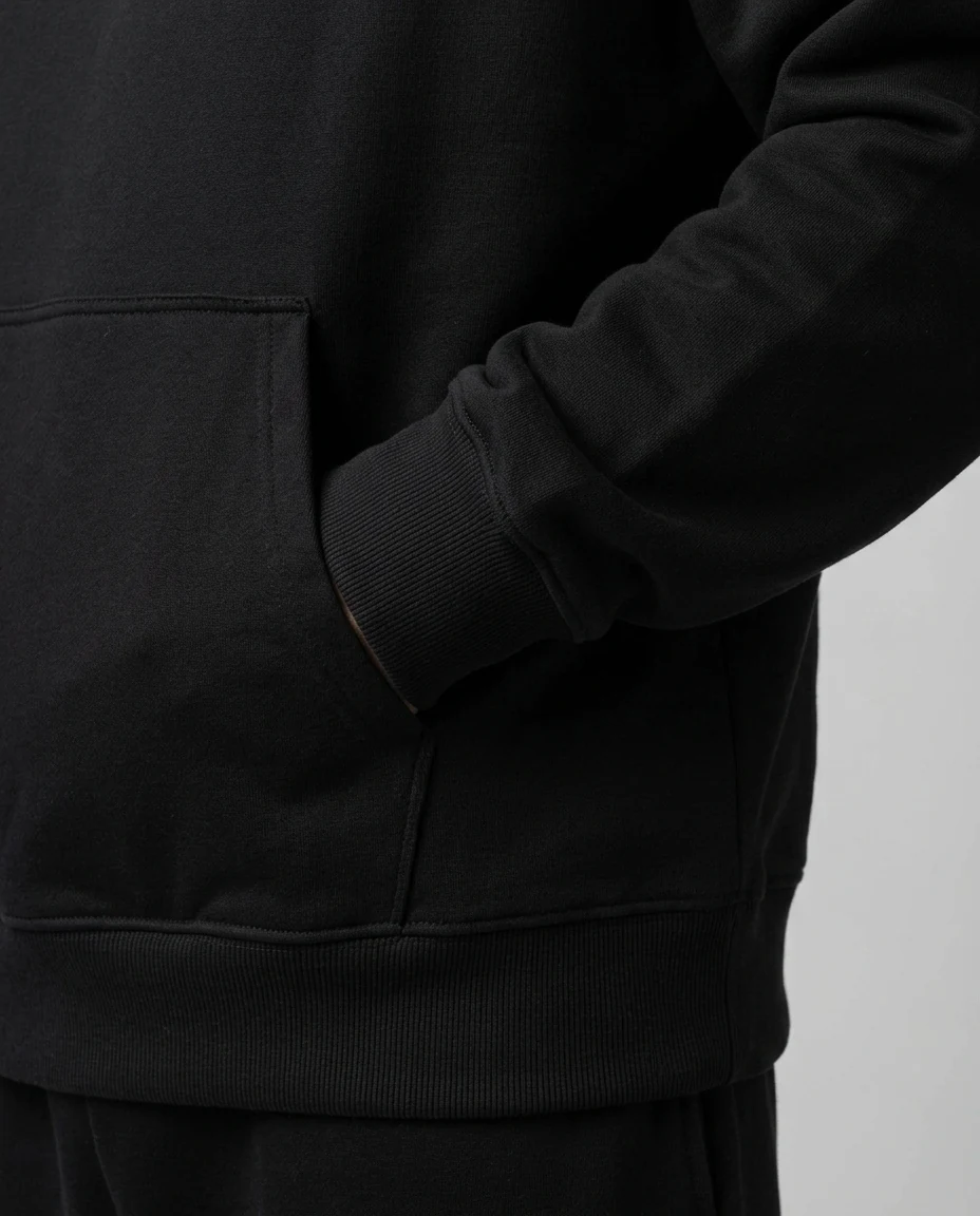 AI-generated black graphic hoodie photography: cuff detail