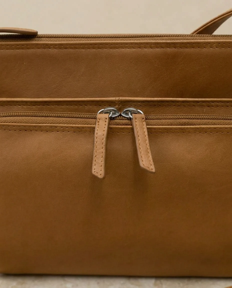 AI-generated saddle leather crossbody photography: leather detail