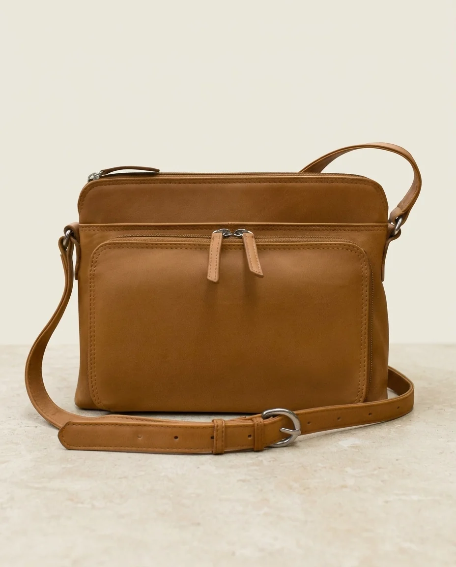 Saddle leather crossbody in an AI-generated setting